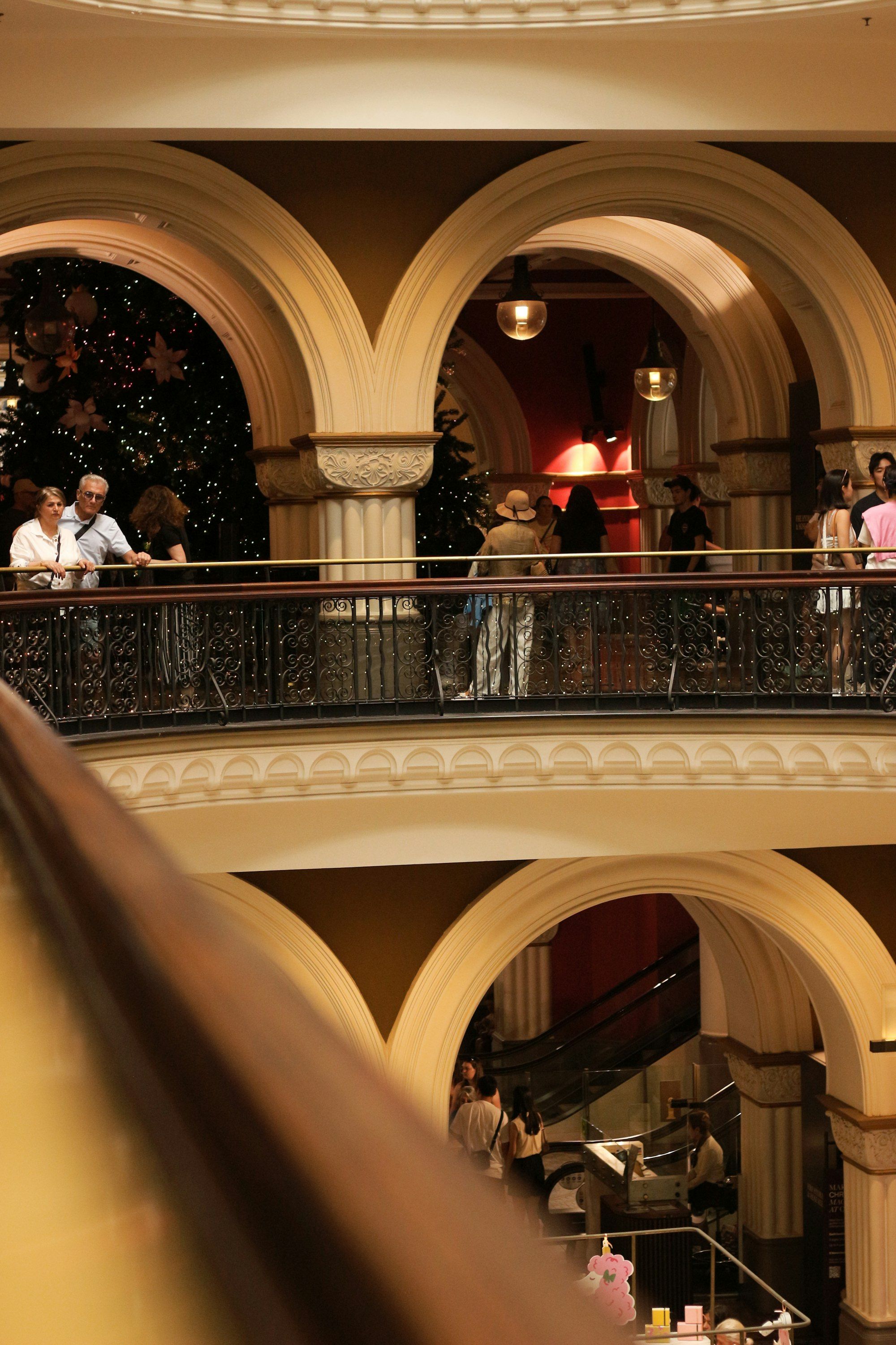 Shoppers on the balconies of Sydney's Queen Victoria Building around a giant Christmas tree