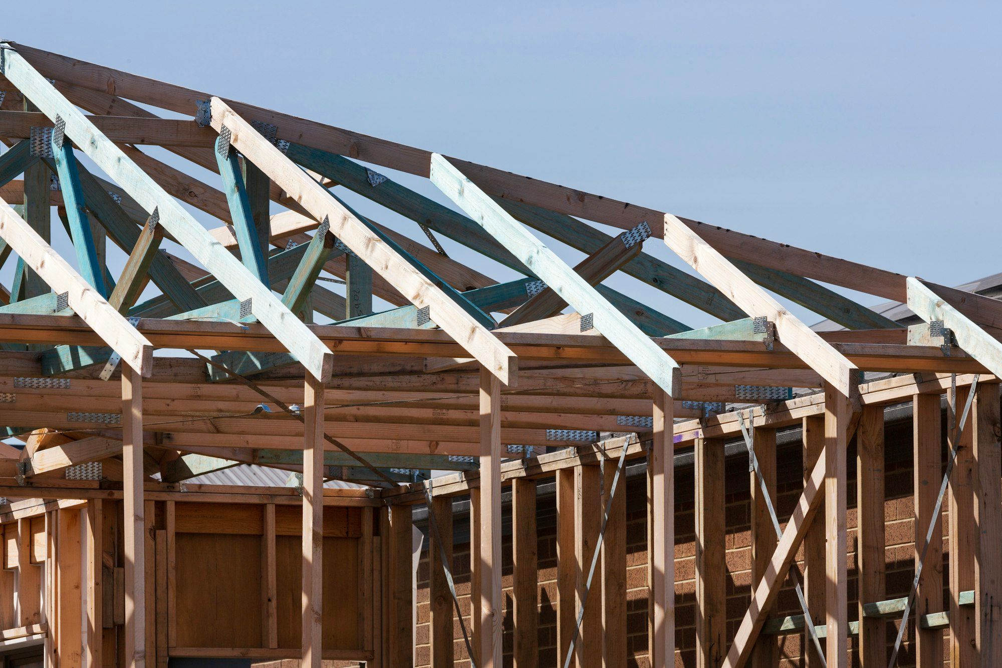 Timber roof trusses going up on a new house build in Clyde North, Victoria